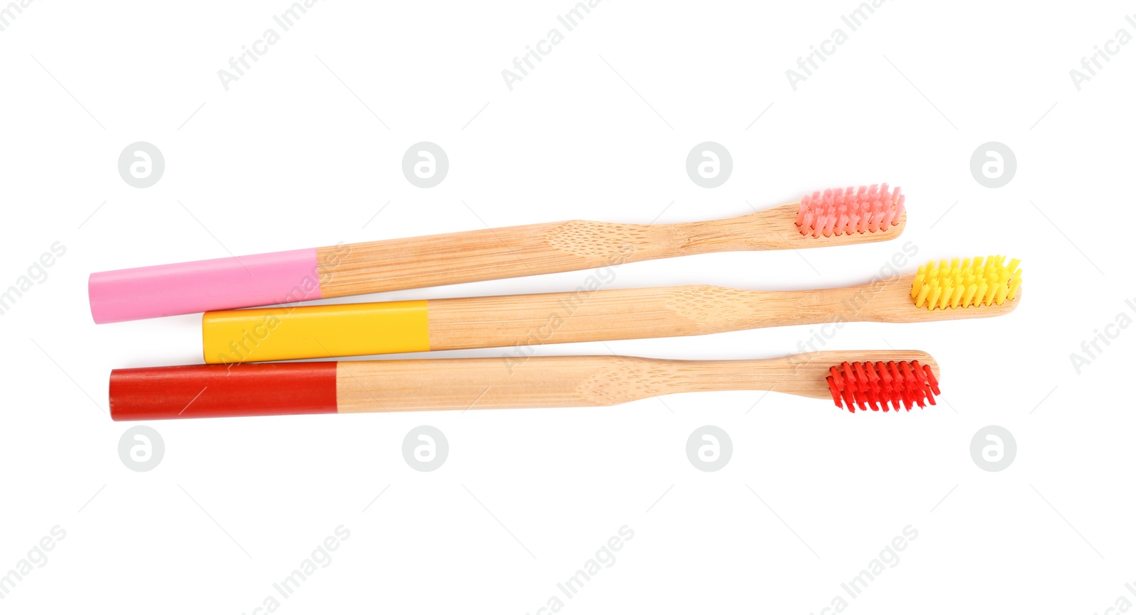 Photo of Natural toothbrushes made with bamboo isolated on white, top view