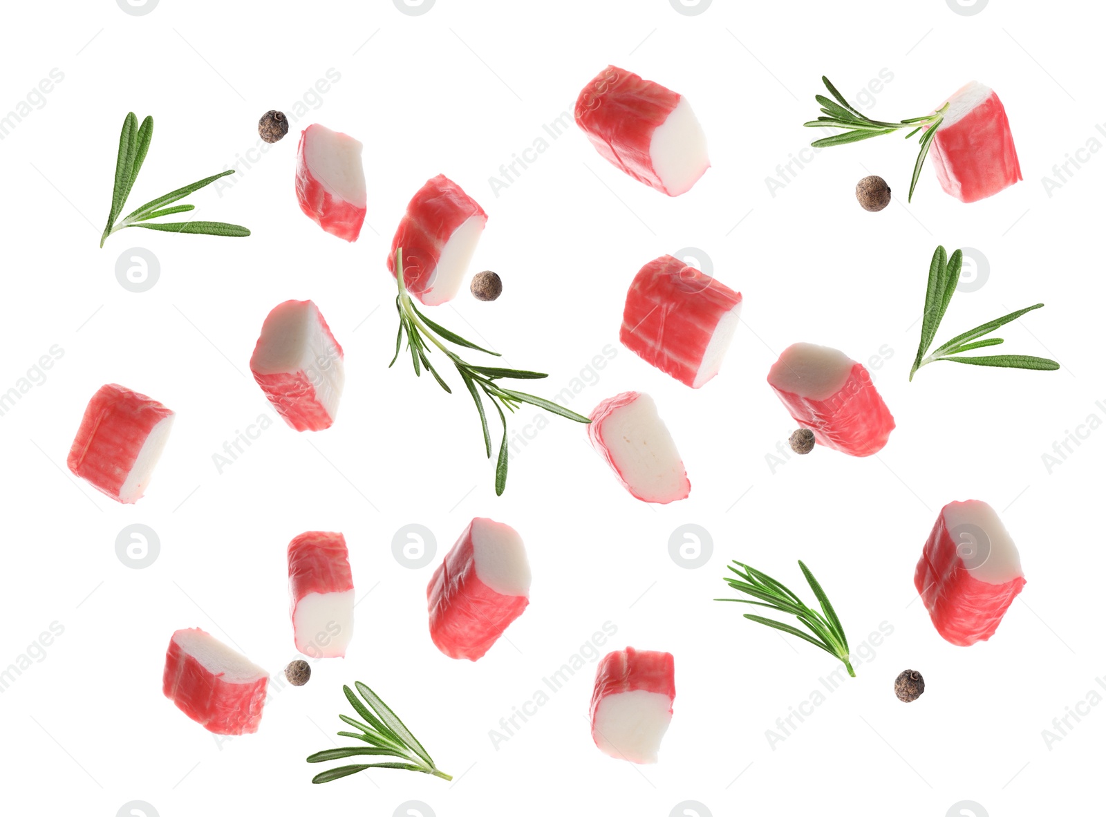 Image of Cut fresh crab sticks, rosemary and allspice falling on white background