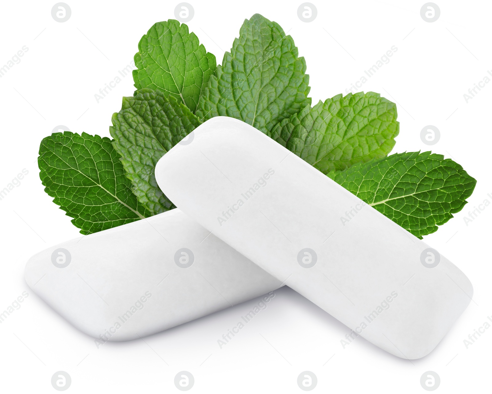 Image of Menthol chewing gum pillows and mint leaves on white background