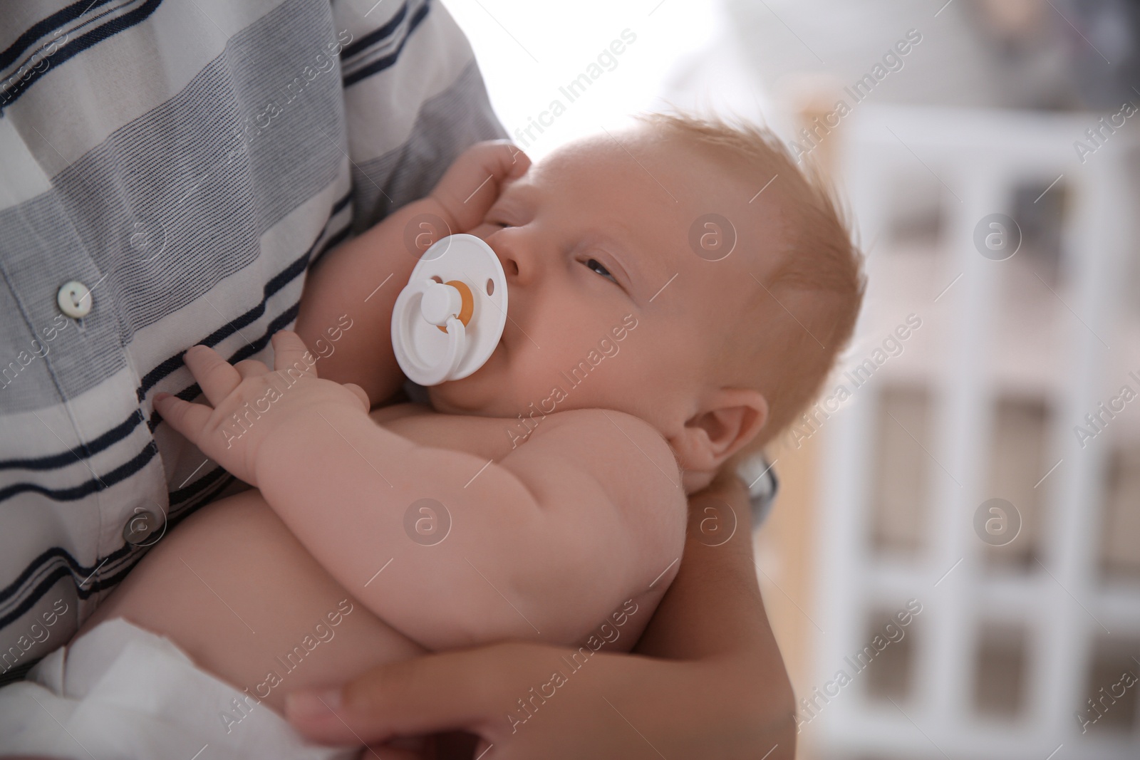 Photo of Mother with her newborn baby, closeup view