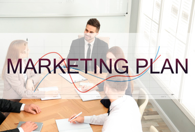 Image of  Digital marketing plan. Team of professionals working together at table in office
