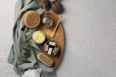 Photo of Composition with different spa products and reed air freshener on light grey textured table, top view. Space for text