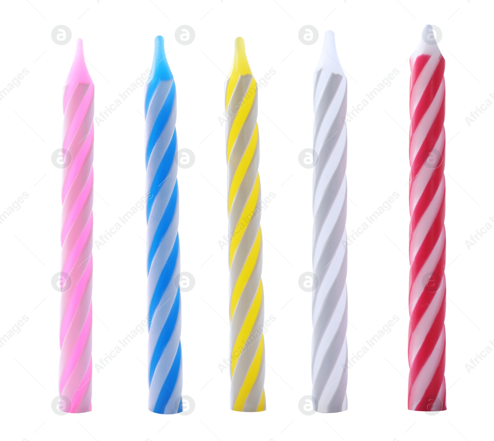 Photo of Set of colorful striped birthday candles isolated on white