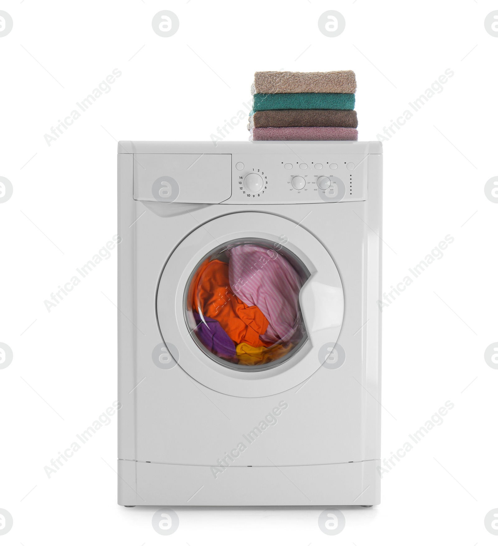 Photo of Modern washing machine with laundry and stack of towels on white background