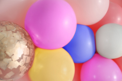 Beautiful colorful balloons on light background, closeup. Party decor 