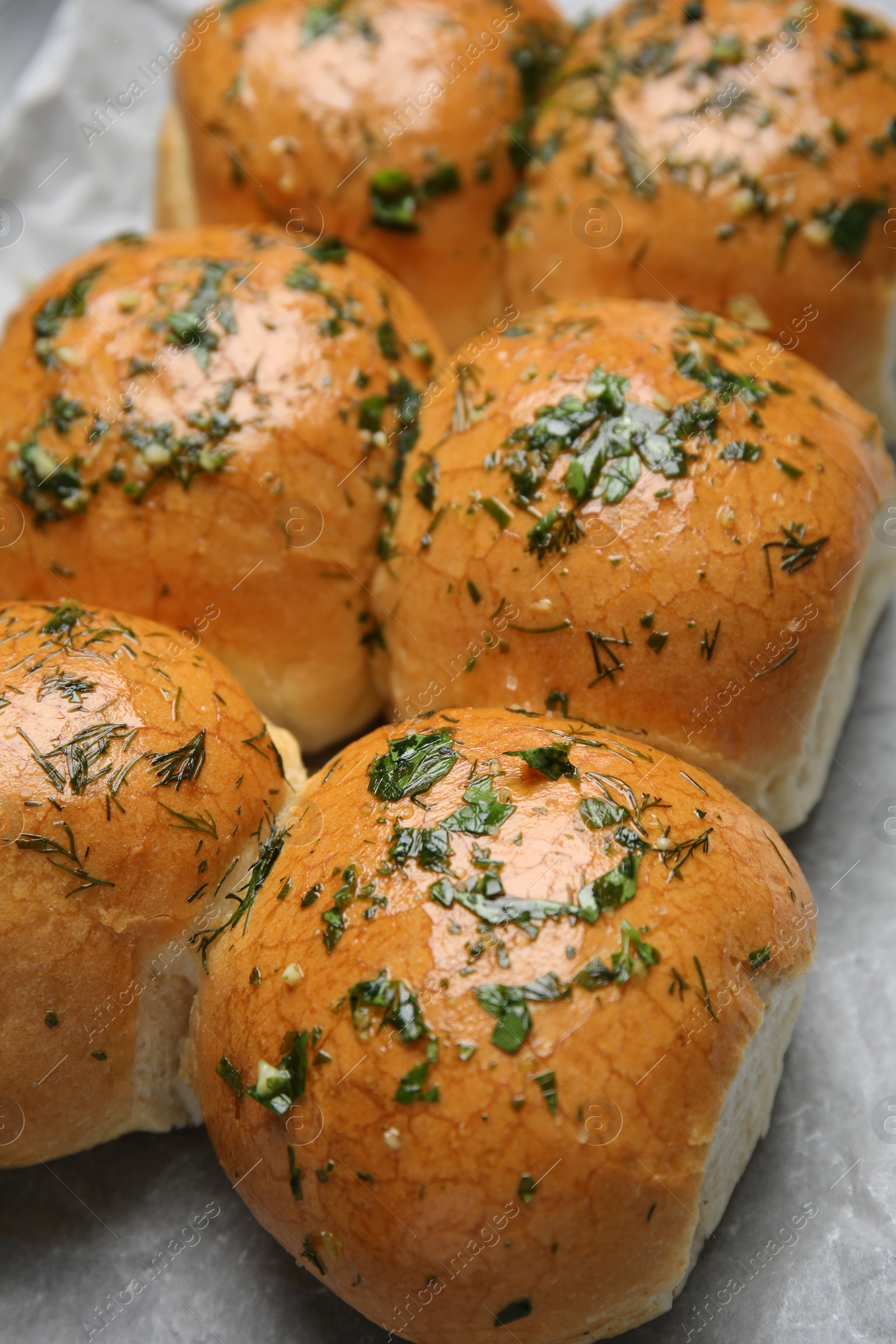 Photo of Traditional pampushka buns with garlic and herbs, closeup