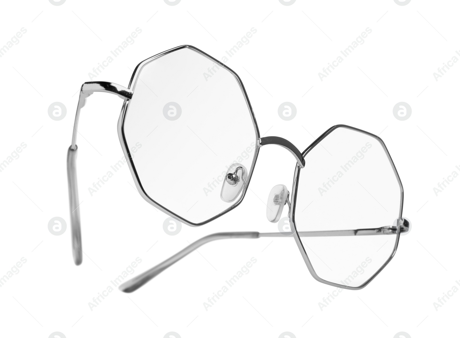 Photo of Stylish glasses with metal frame isolated on white