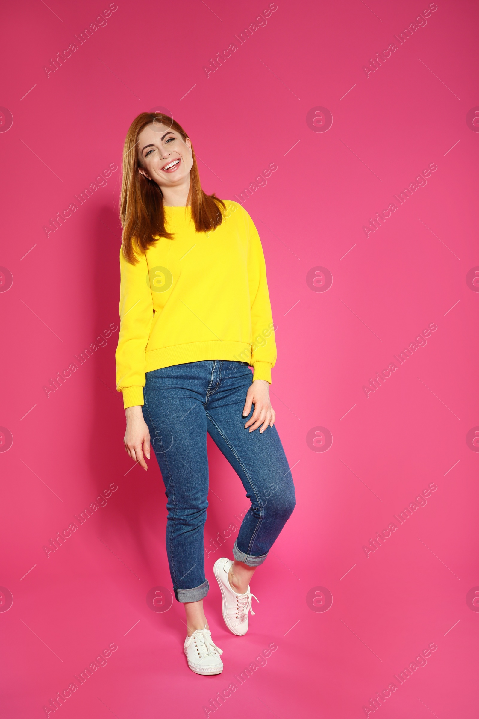 Photo of Full length portrait of beautiful woman on color background