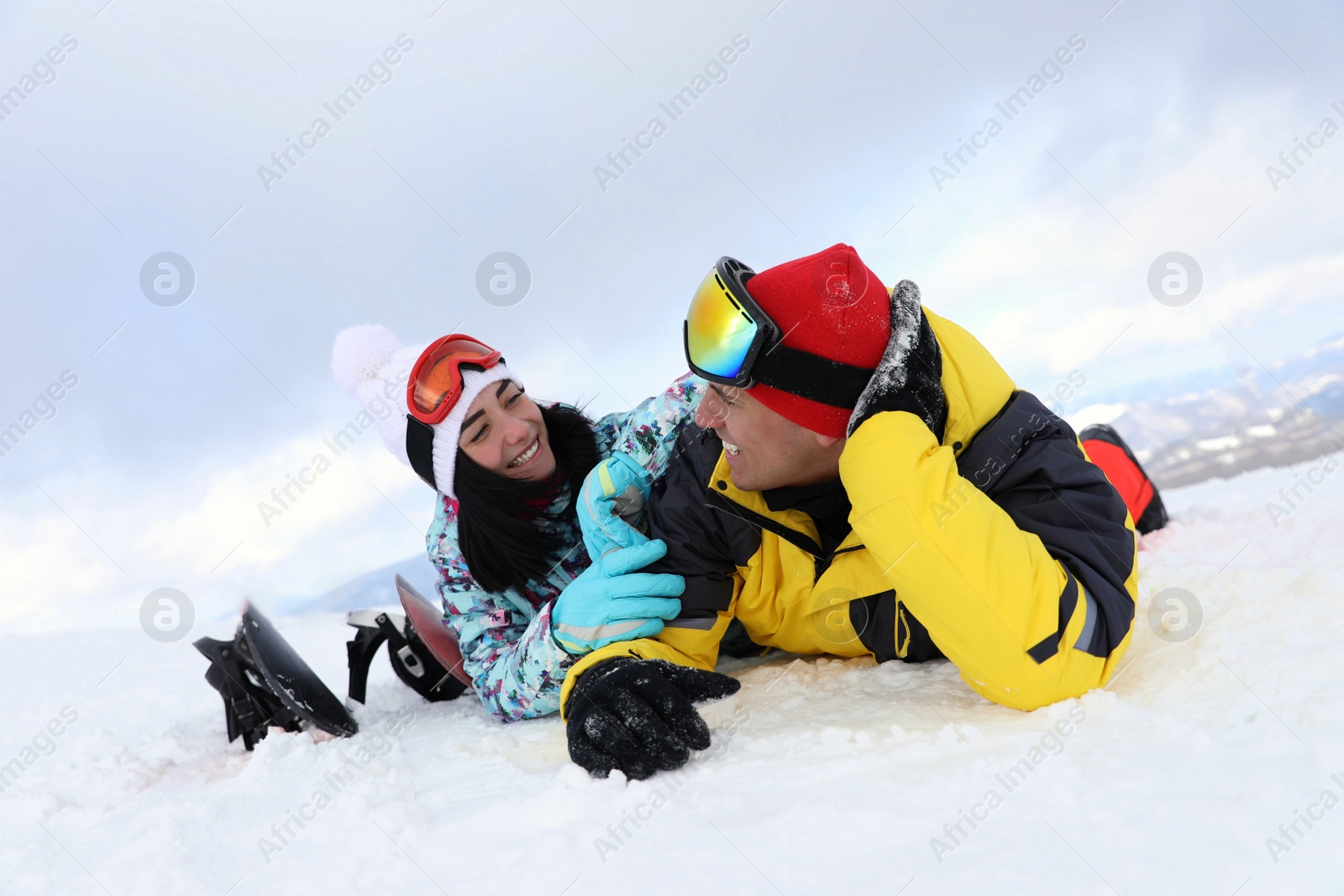 Photo of Lovely couple on snowy hill. Winter vacation