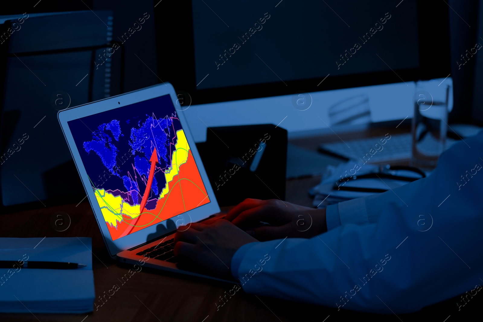 Image of Man analyzing situation on international market via laptop, closeup. World map and charts on screen