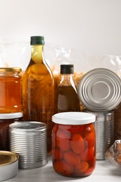 Different products on white wooden table. Food donation