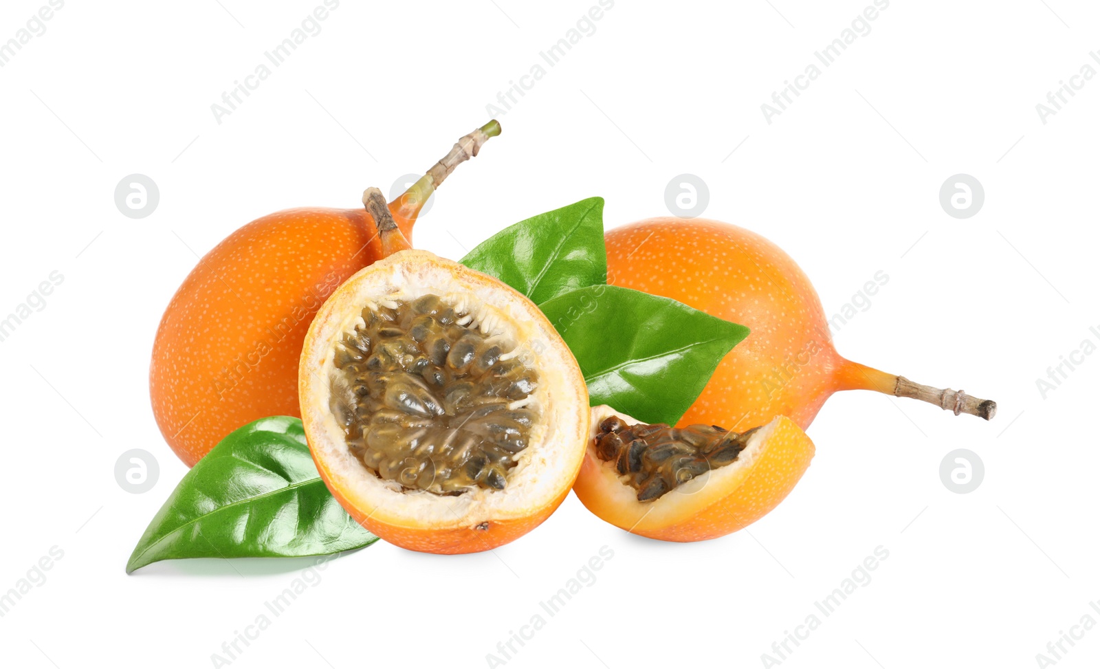 Image of Tasty ripe granadillas and green leaves on white background