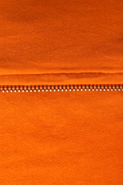 Photo of Texture of orange material as background, closeup