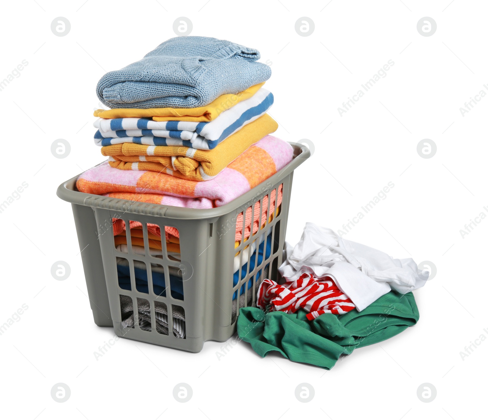 Photo of Plastic laundry basket and clean clothes isolated on white