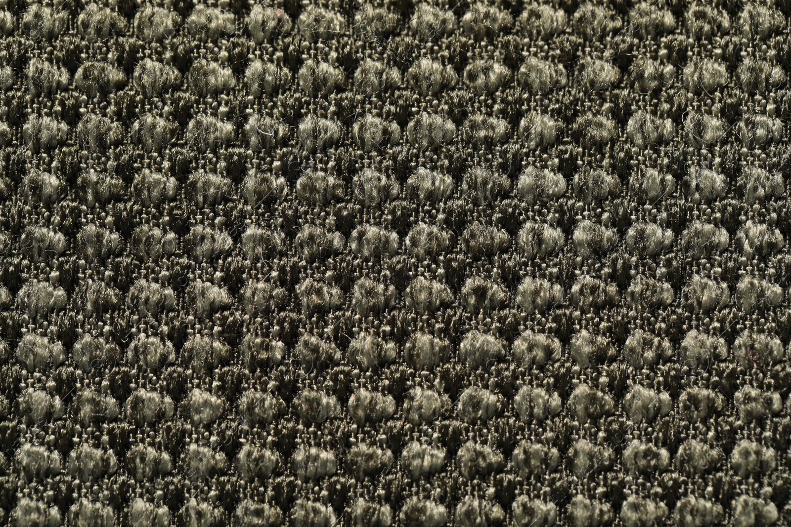 Photo of Texture of dark fabric as background, top view