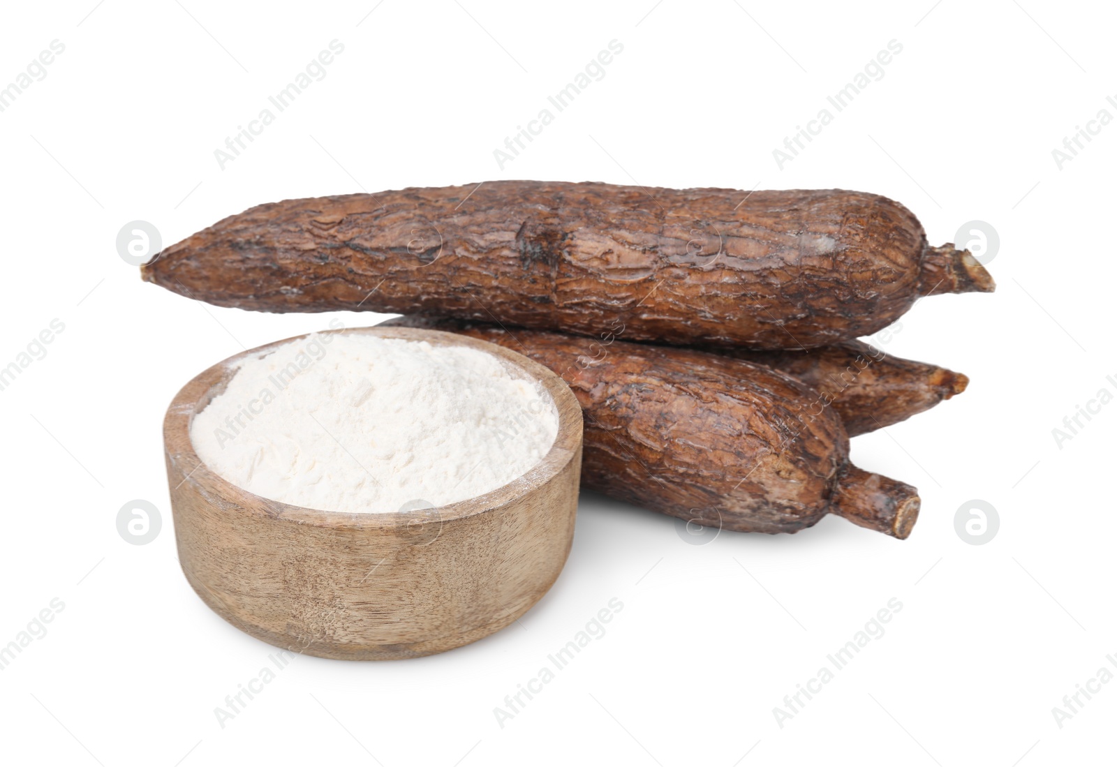 Photo of Bowl with cassava flour and roots isolated on white