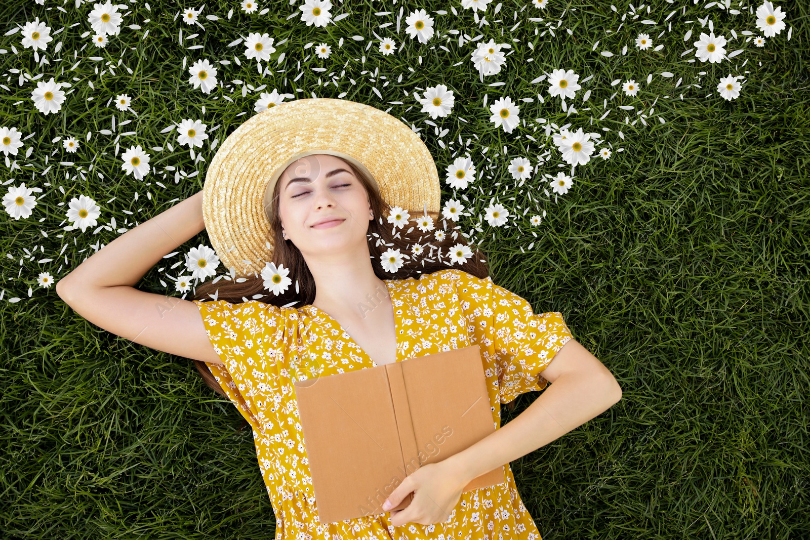 Image of Beautiful young woman with closed eyes lying on green grass, top view. Flowers and petals near her head symbolizing state of mindfulness