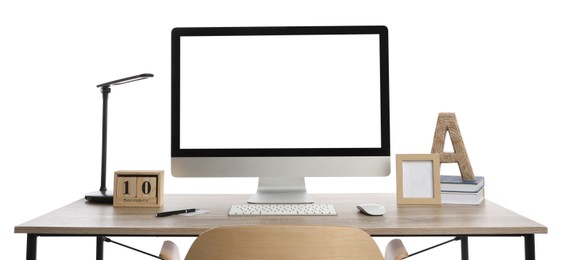 Photo of Wooden table with modern computer, decor and stationery on white background