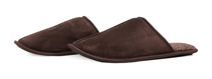 Photo of Pair of brown slippers on white background