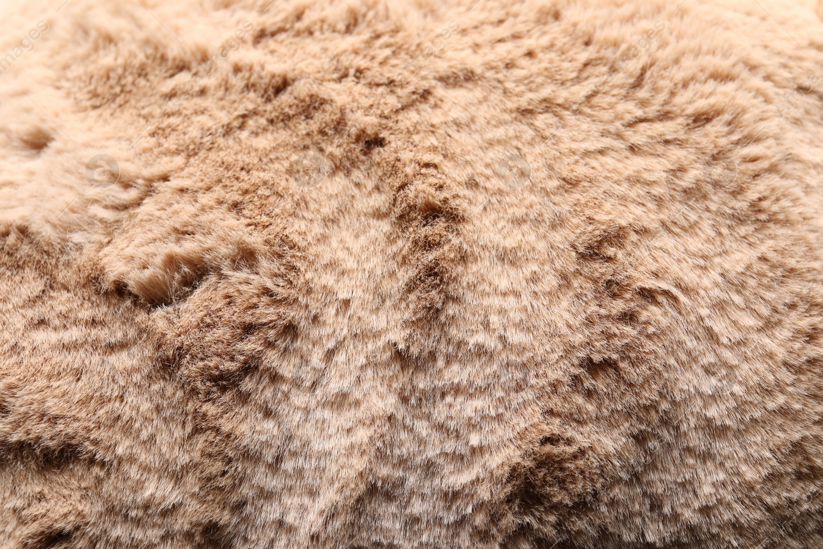 Photo of Texture of brown faux fur as background, closeup