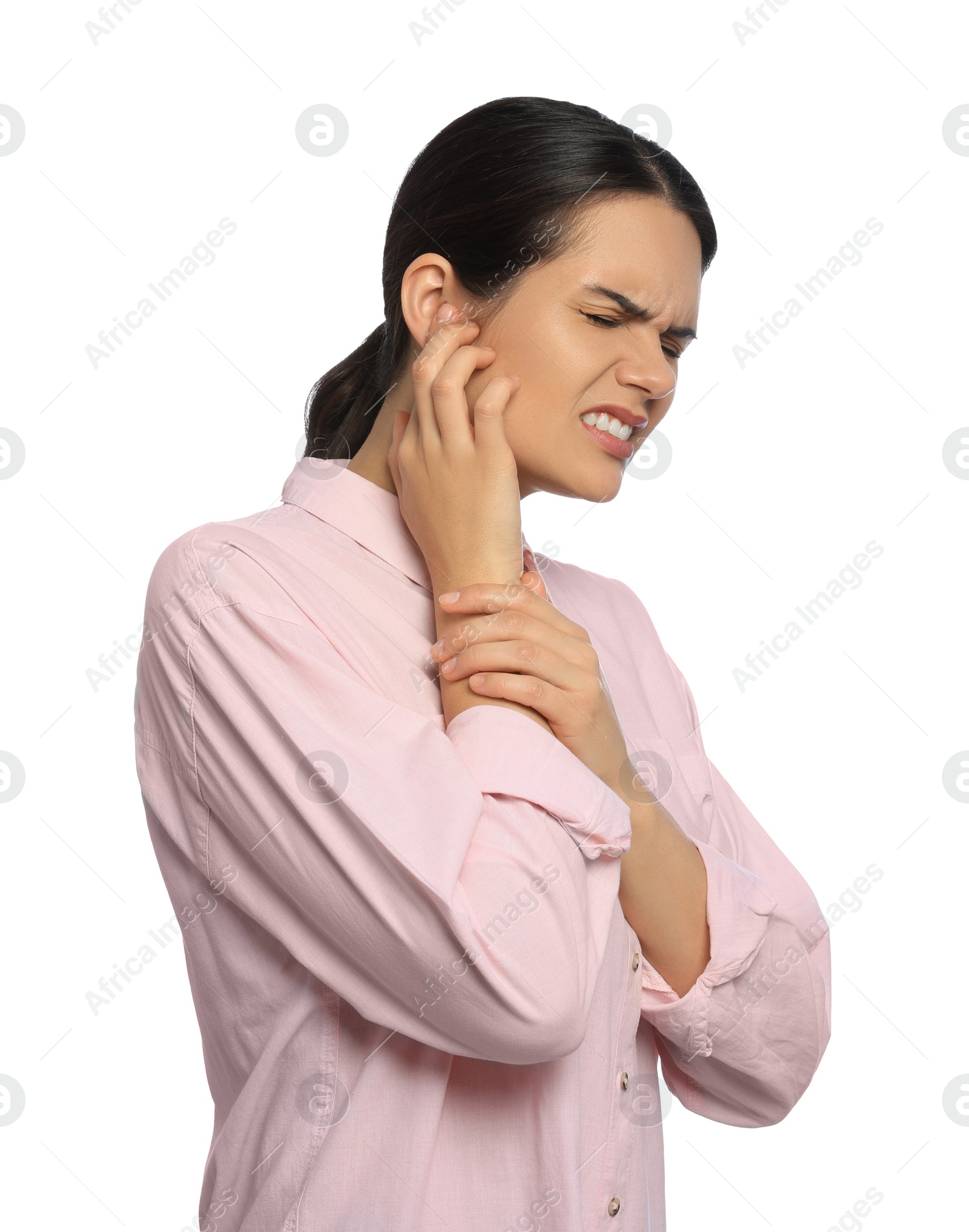 Photo of Young woman suffering from ear pain on white background