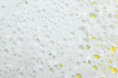 Photo of Color washing foam as background, top view