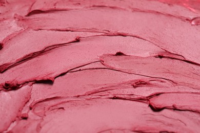 Texture of red lipstick as background, closeup