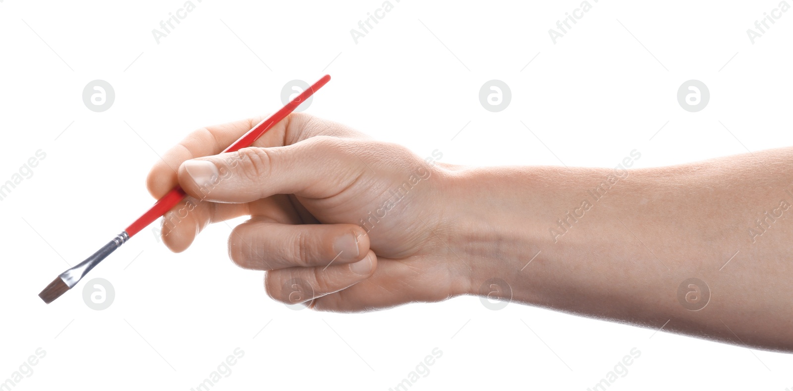 Photo of Man holding paint brush on white background, closeup