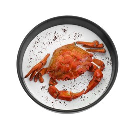 Photo of Delicious boiled crab with cream sauce in bowl isolated on white, top view