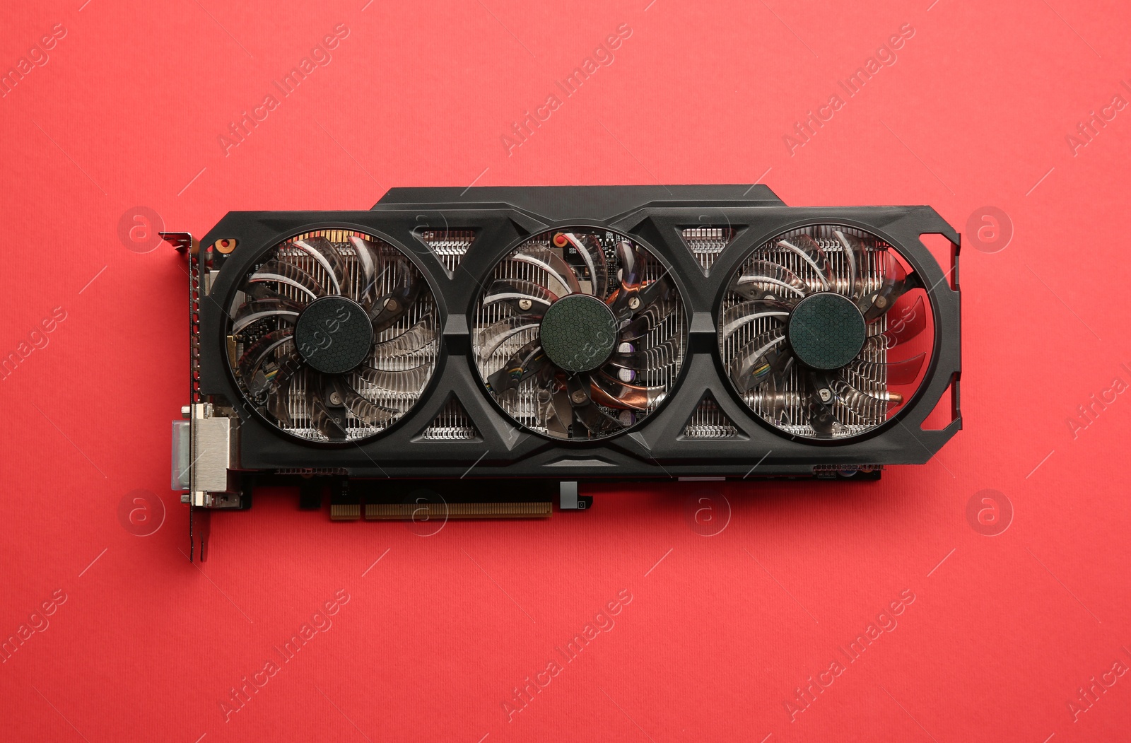 Photo of One graphics card on red background, top view