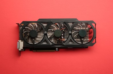 Photo of One graphics card on red background, top view