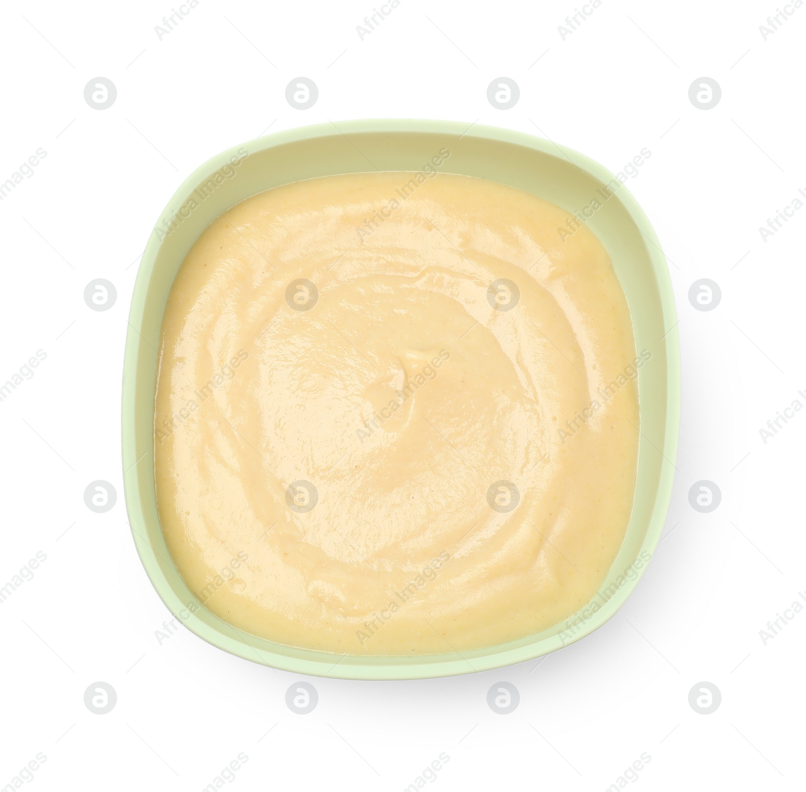 Photo of Tasty baby food in bowl isolated on white, top view
