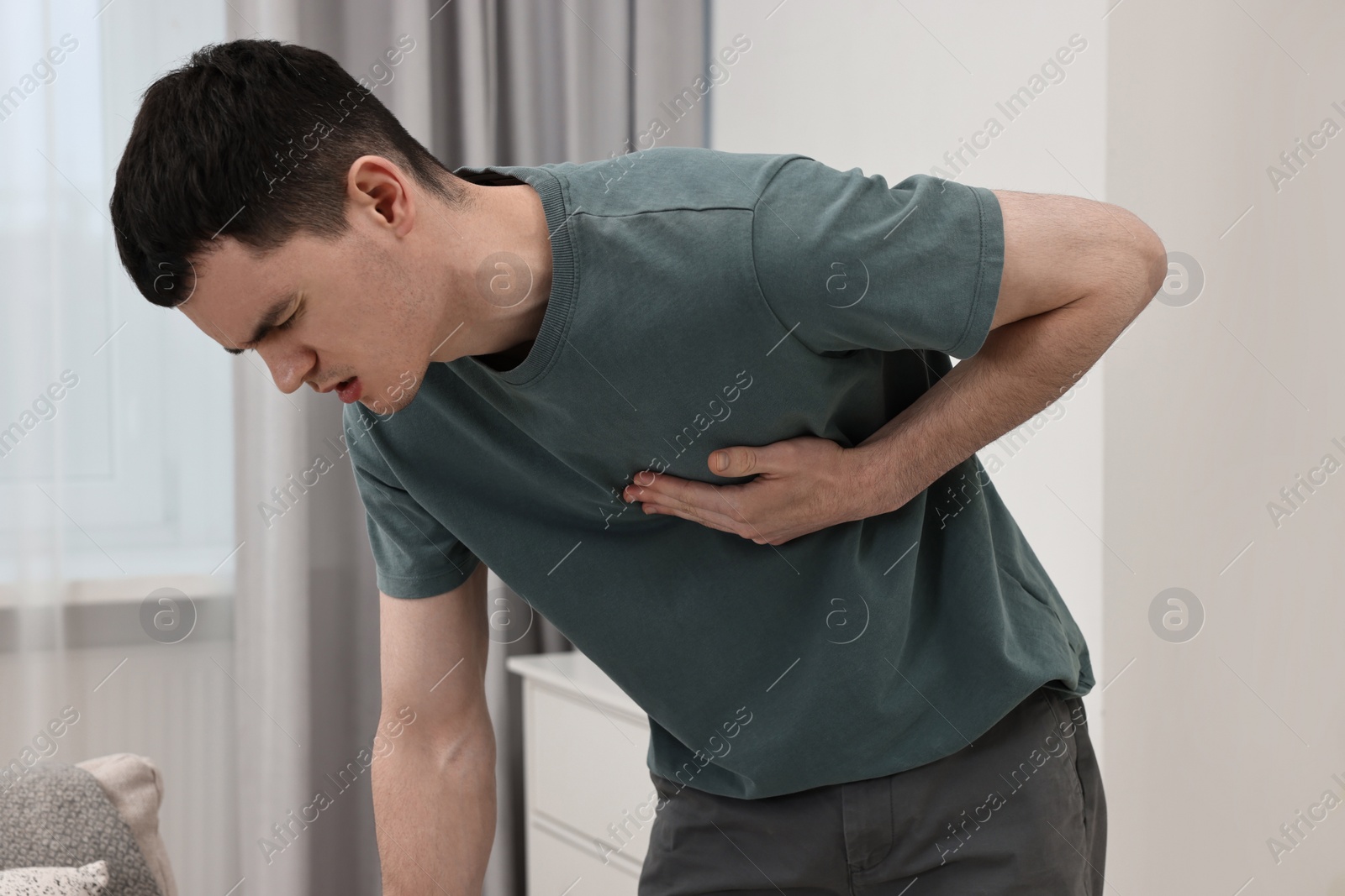 Photo of Young man suffering from heart hurt at home