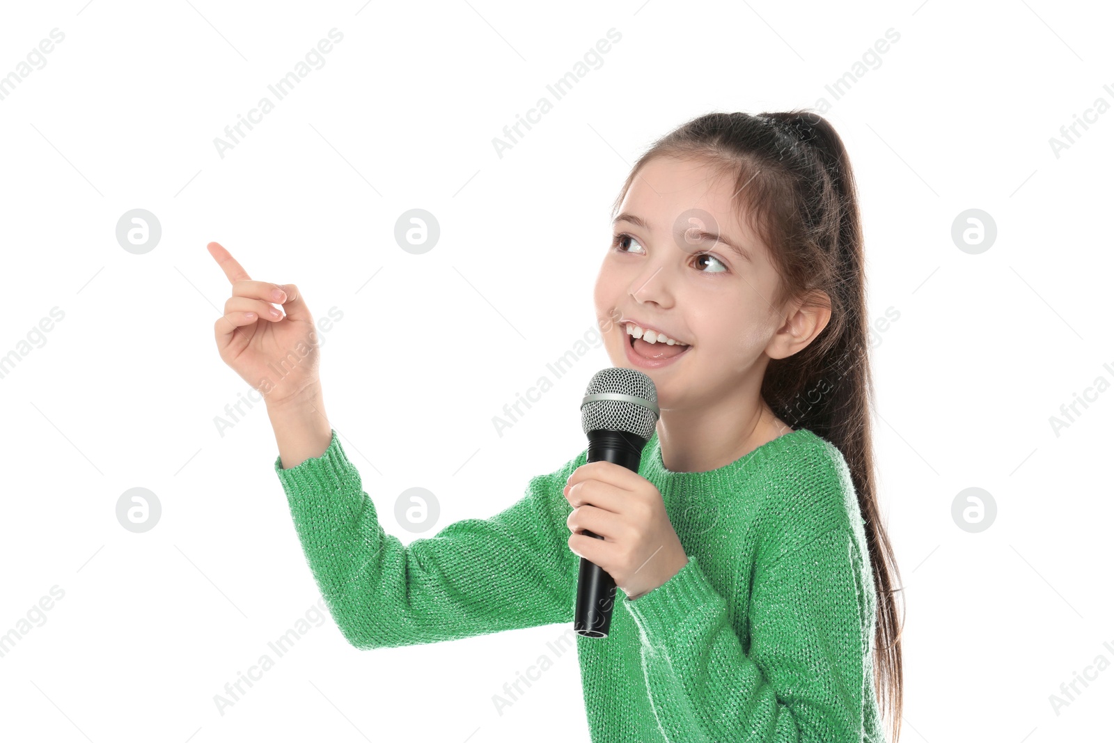 Photo of Little girl singing into microphone on white background