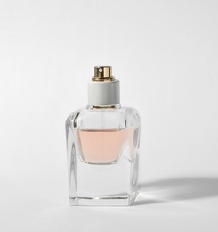 Photo of Bottle of perfume on light background