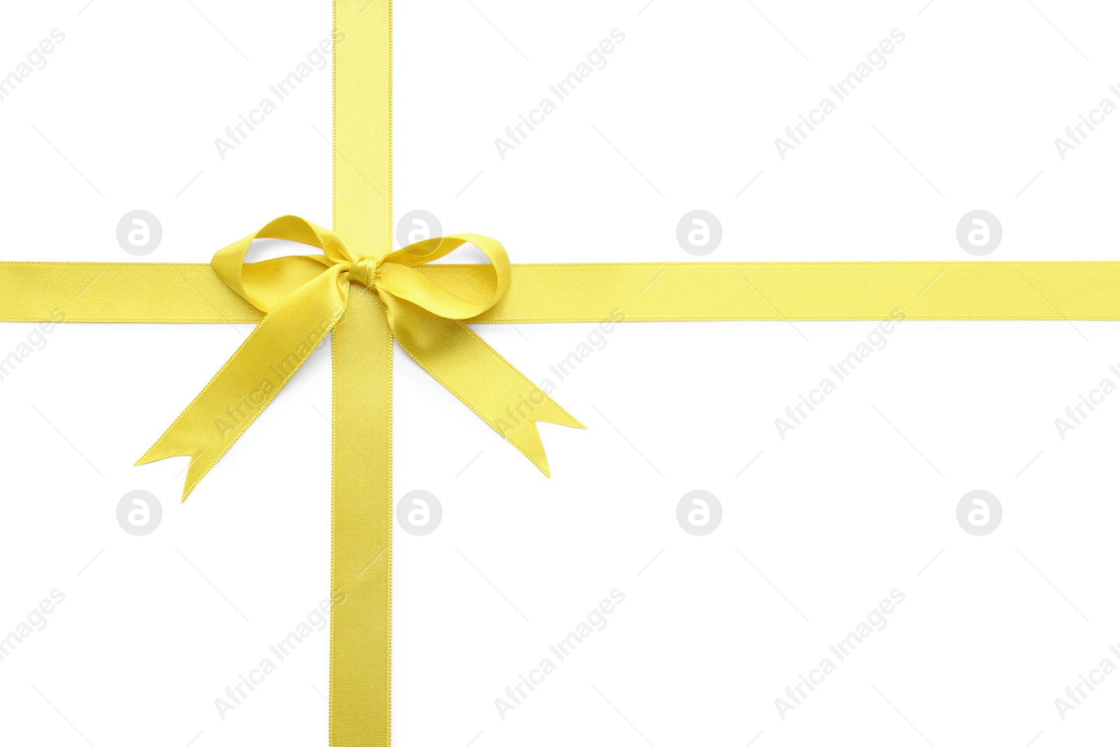 Photo of Yellow satin ribbon with bow on white background, top view