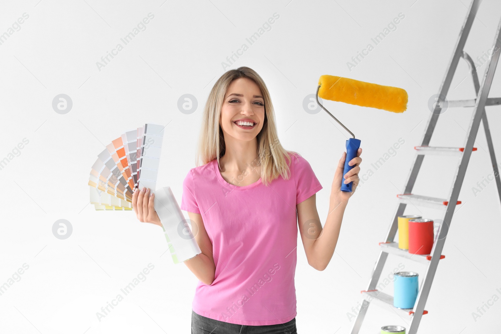 Photo of Young woman with color palette on white background
