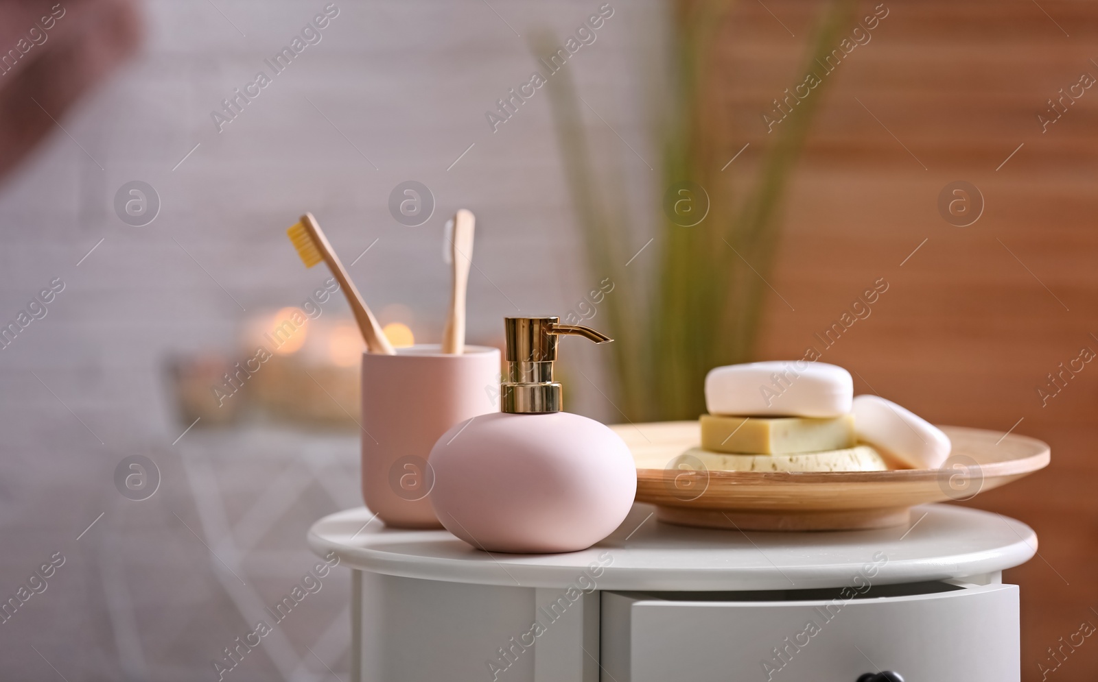 Photo of Aromatic soap and shampoo on table against blurred background. Space for text