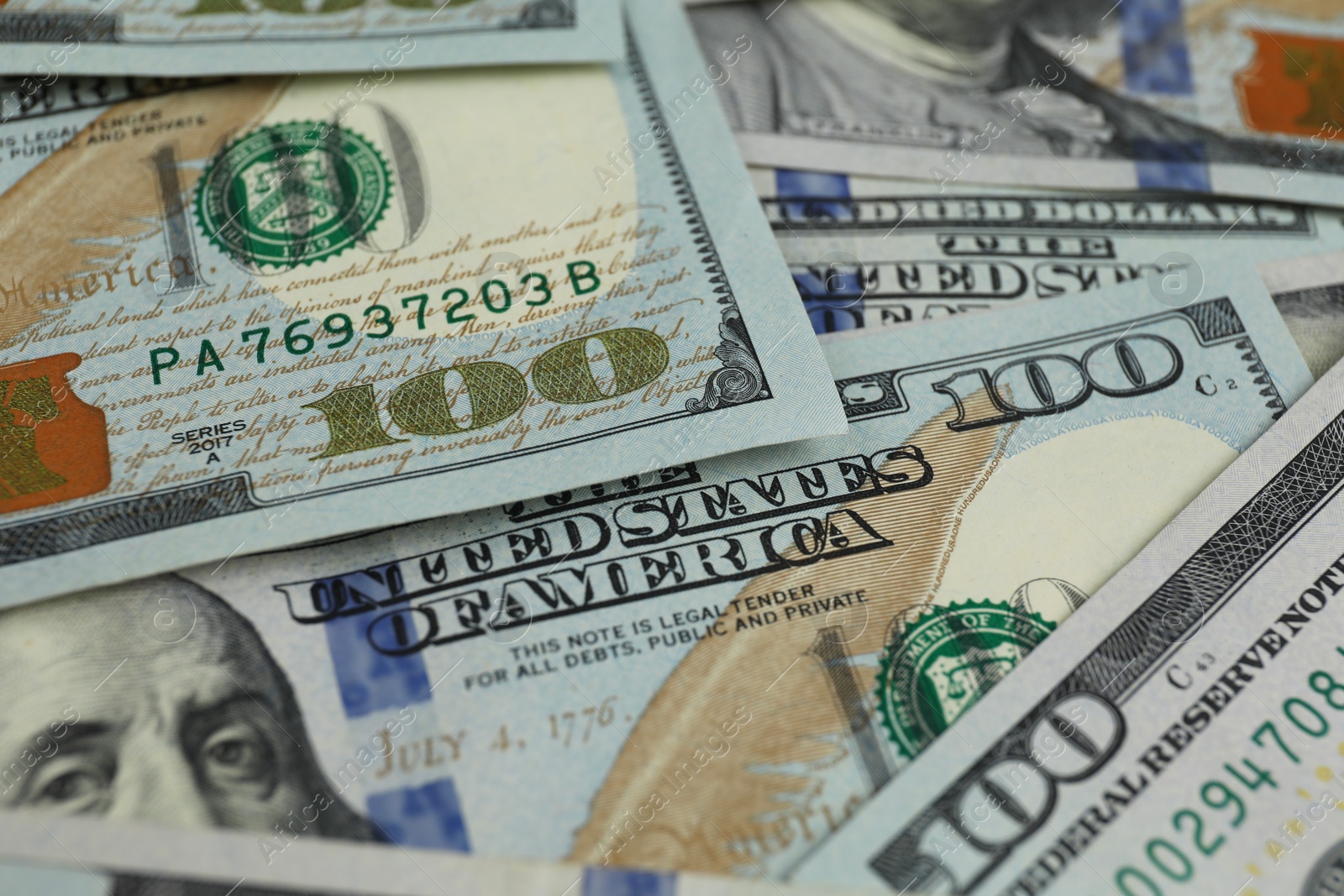 Photo of Money exchange. Dollar banknotes as background, closeup