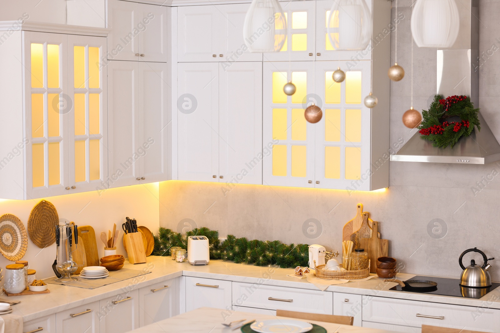 Photo of Stylish kitchen decorated for Christmas. Interior design