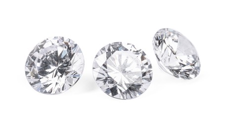 Three beautiful shiny diamonds isolated on white