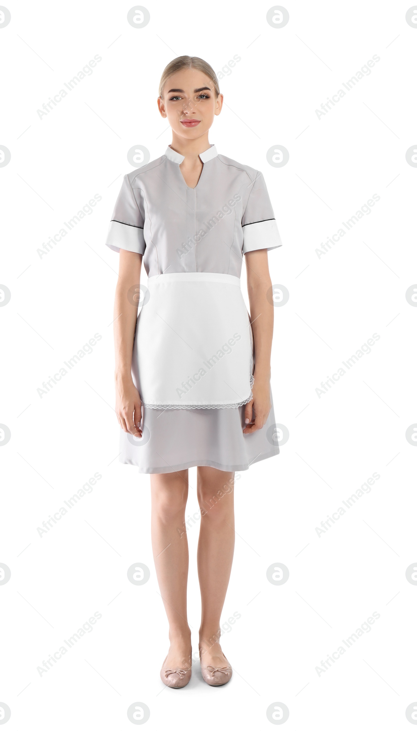 Photo of Full length portrait of young chambermaid in tidy uniform on white background