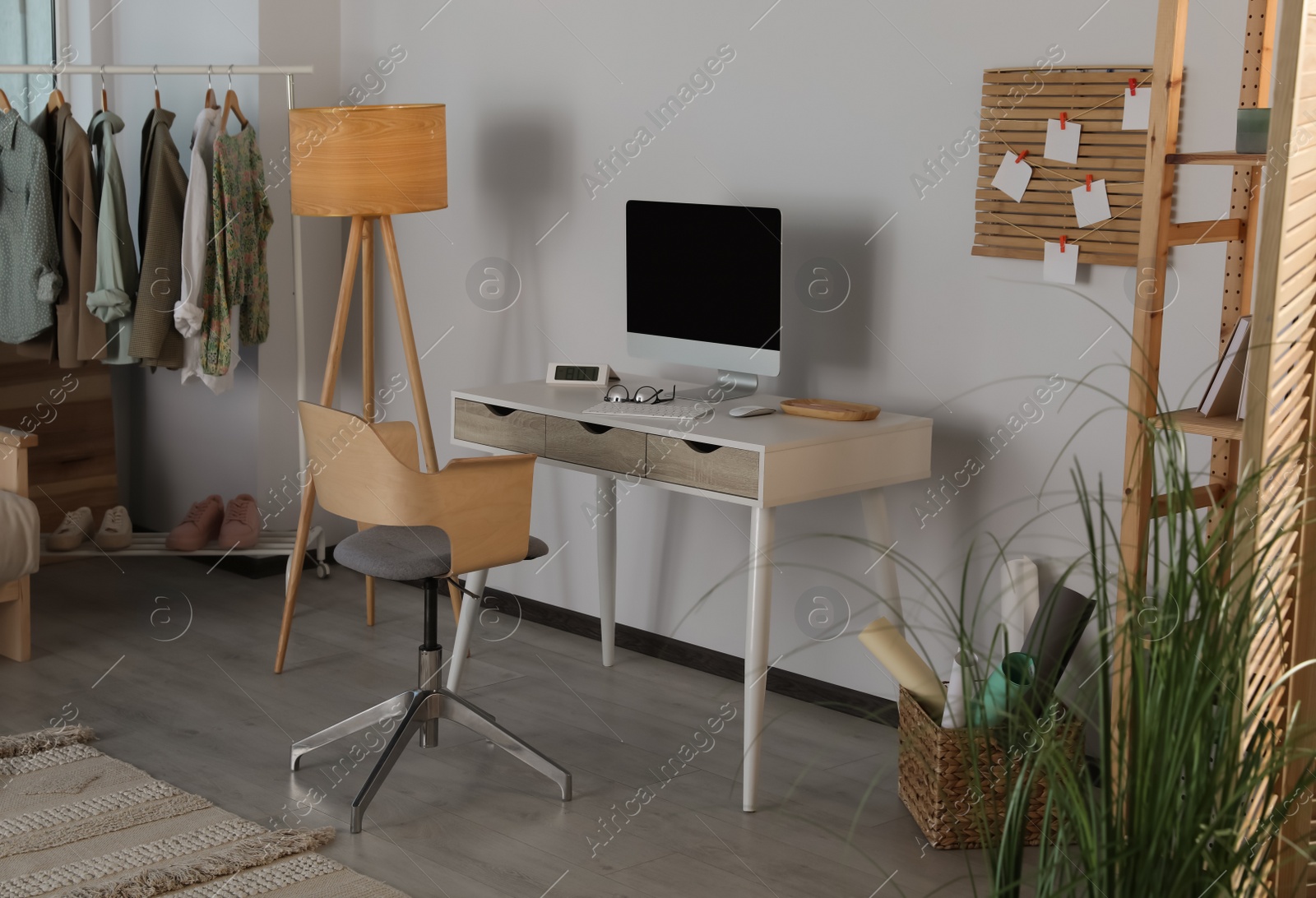 Photo of Stylish home office interior with comfortable workplace