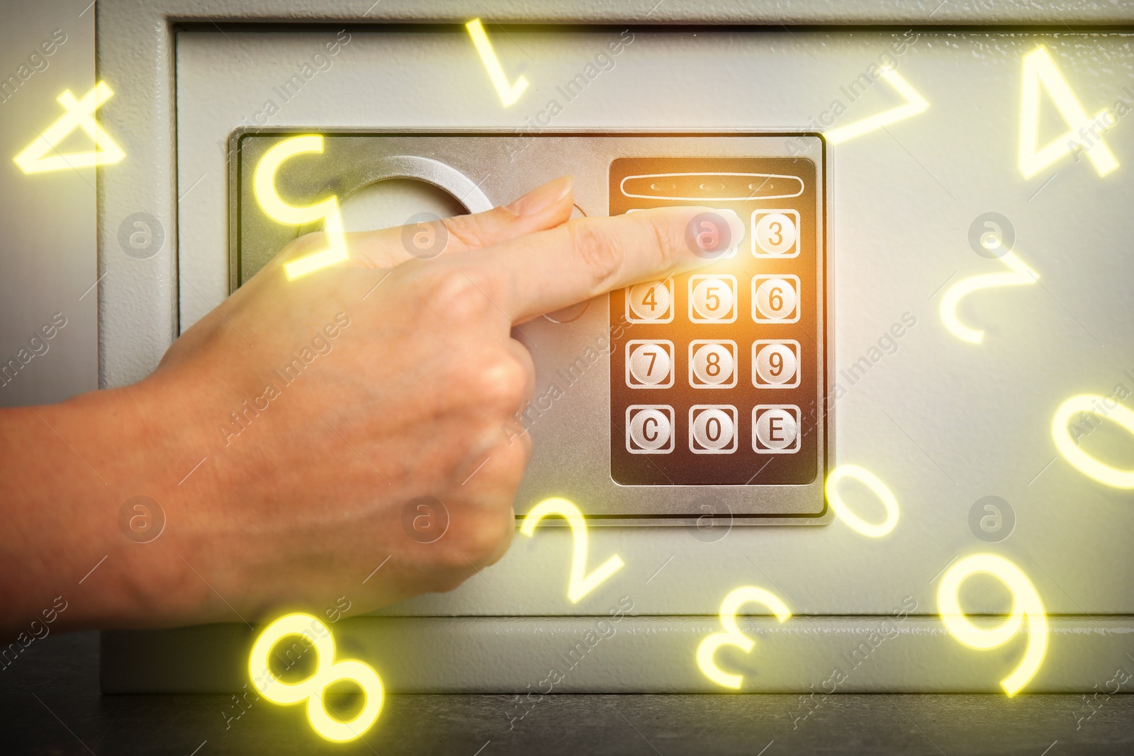 Image of Woman pressing buttons on keypad to lock steel safe, closeup. Numbers symbolizing code combination flying around