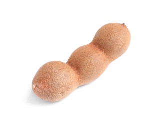 Photo of Delicious ripe tamarind on white background. Exotic fruit