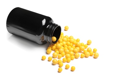 Photo of Bottle with vitamin pills on white background