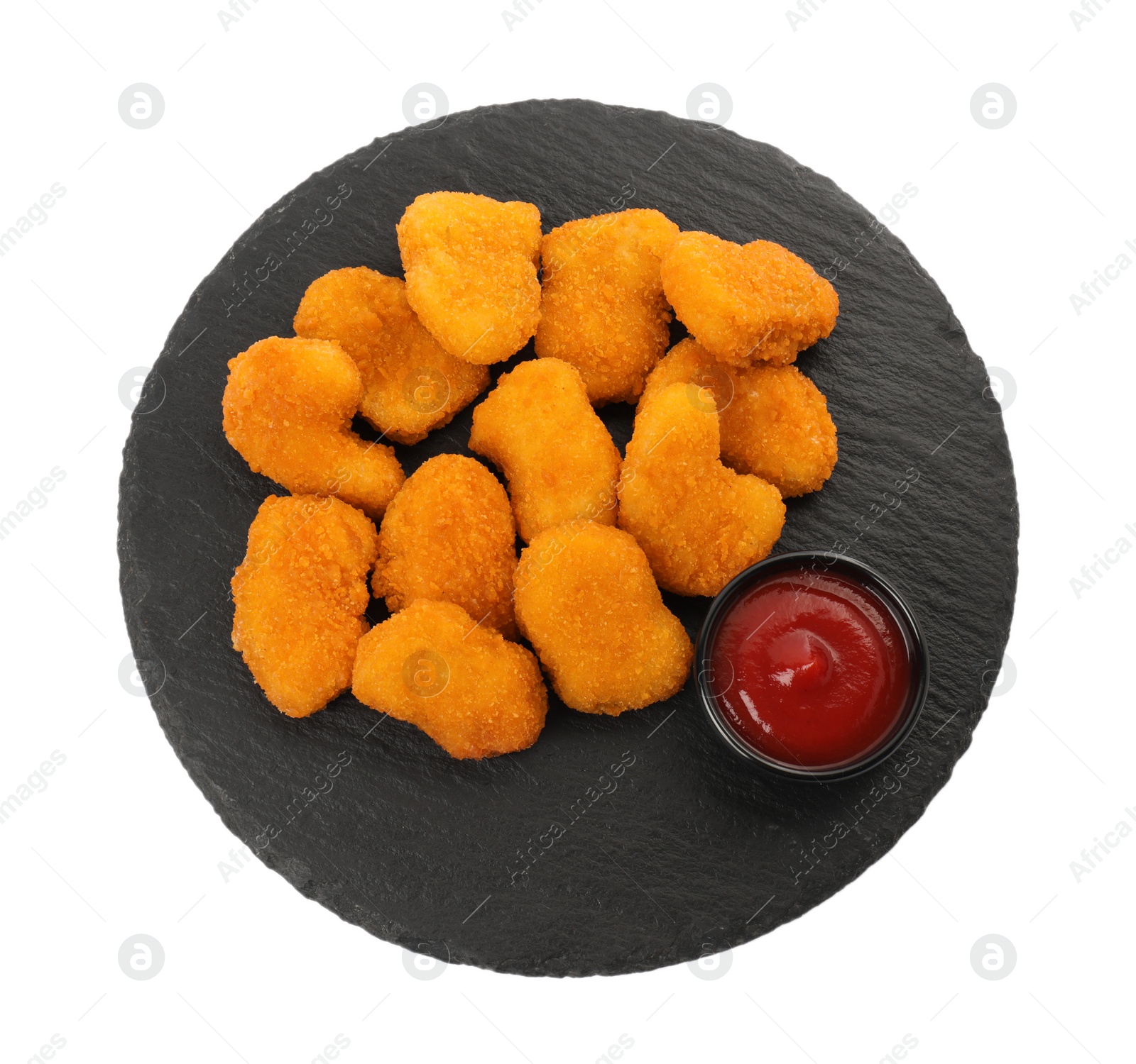 Photo of Tasty chicken nuggets with ketchup isolated on white, top view