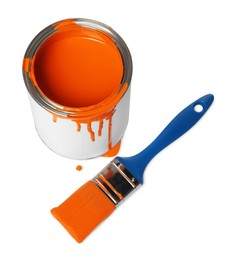 Photo of Can of orange paint and brush on white background, above view
