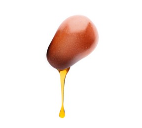 Image of Oil dripping from palm fruit on white background