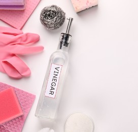 Photo of Eco friendly natural cleaners. Flat lay composition with bottle of vinegar on white background, space for text